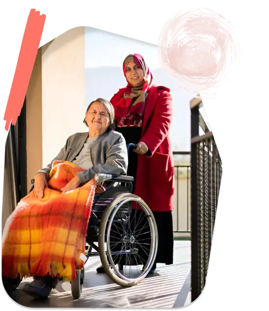 NDIS Services - A lady siting on wheelchair and Girl Smiling