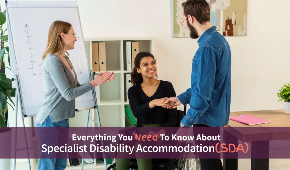 A man is shaking hand with a disabled girl who is siting on wheelchair and a girl smiling and clapping standing next to them